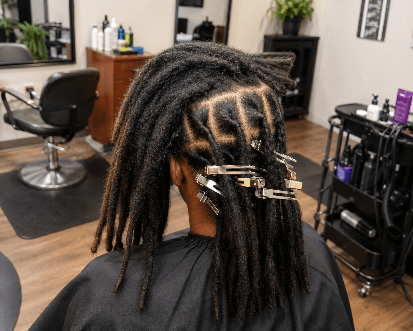 Person receiving a loc retwist